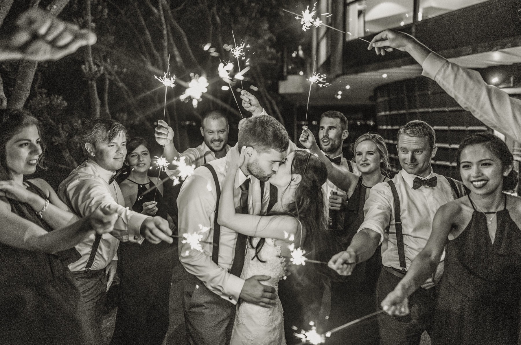 sparklers, reception, wedding, photography, guests, bridal party, bride, groom, kiss